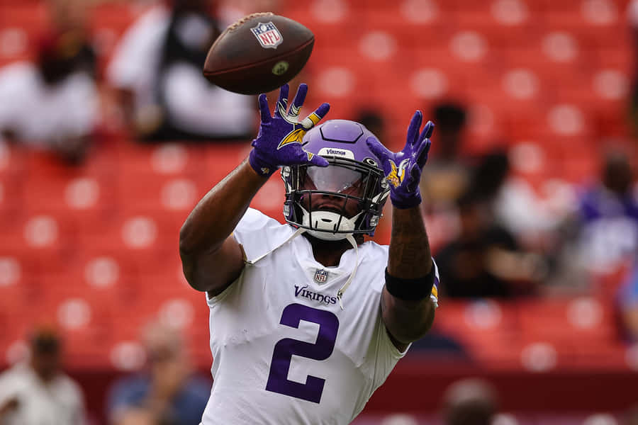 Vikings Player Catching Football Wallpaper