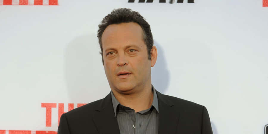 Vince Vaughn Striking A Pose During A Photoshoot Wallpaper