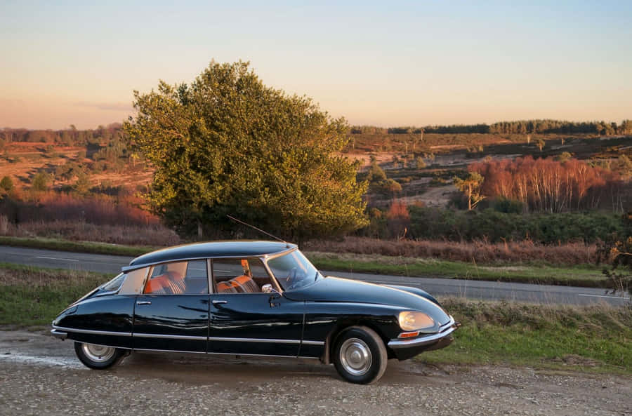 Vintage Citroen D S Countryside Sunset Wallpaper