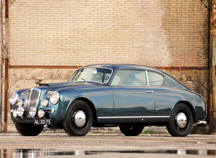 Vintage Elegance - The Lancia Aurelia In Full Glory Wallpaper