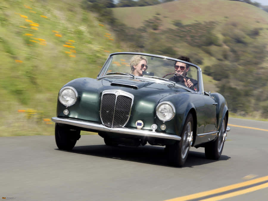 Vintage Lancia Aurelia Convertible Road Trip Wallpaper