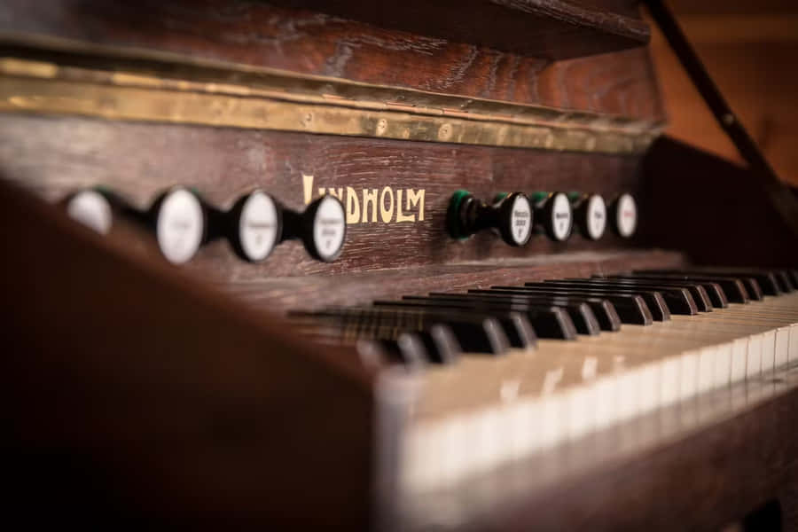 Vintage Piano Keyboardand Brand Name Wallpaper