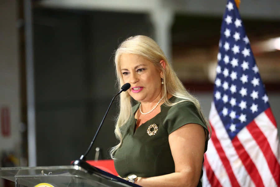 Wanda Vázquez Garced Speaking In Microphone Wallpaper