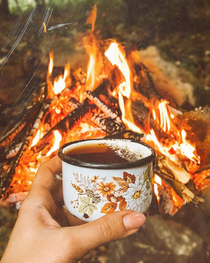 Warm Fall Bonfire Under A Starry Night Wallpaper