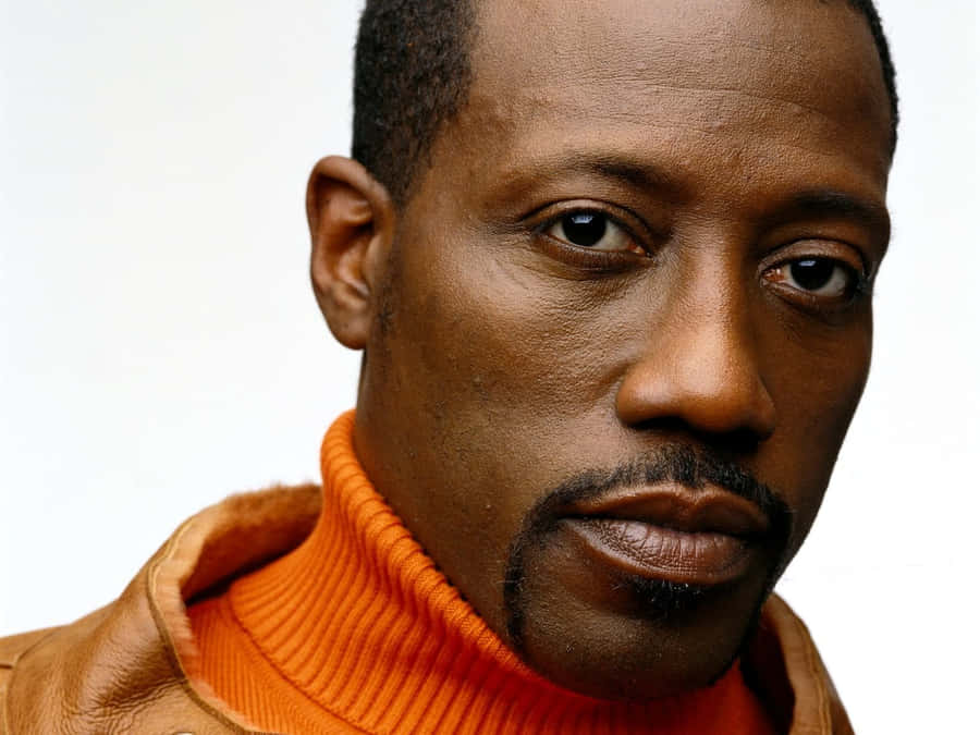 Wesley Snipes Sporting A Fierce Look In A Dark Outfit Wallpaper