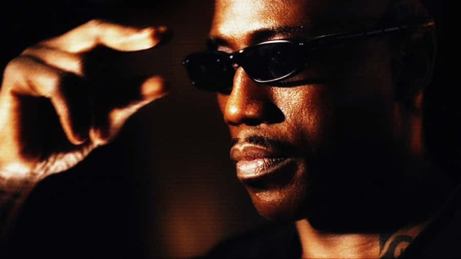 Wesley Snipes Striking A Pose In A Stylish Outfit Wallpaper