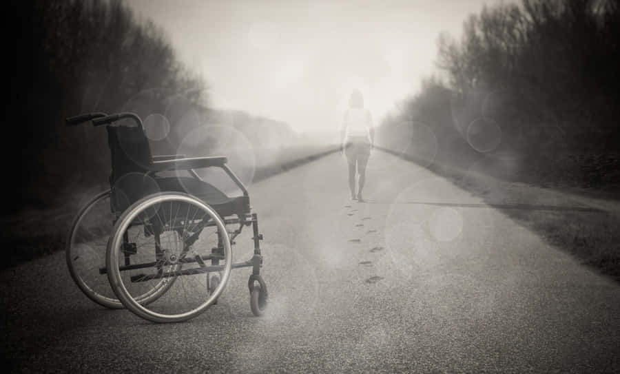 Wheelchair Abandonedon Pathway Wallpaper