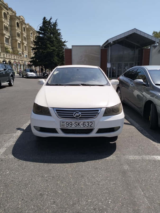 White Lifan620 Sedan Parked Outdoors Wallpaper