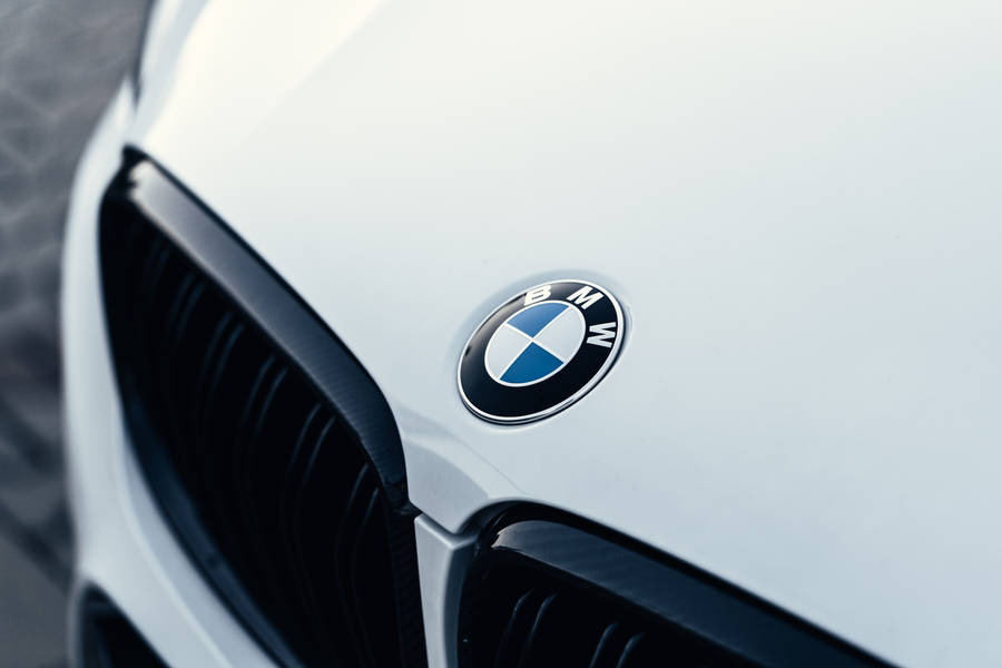 White Luxury Car Hood With Bmw Logo Wallpaper