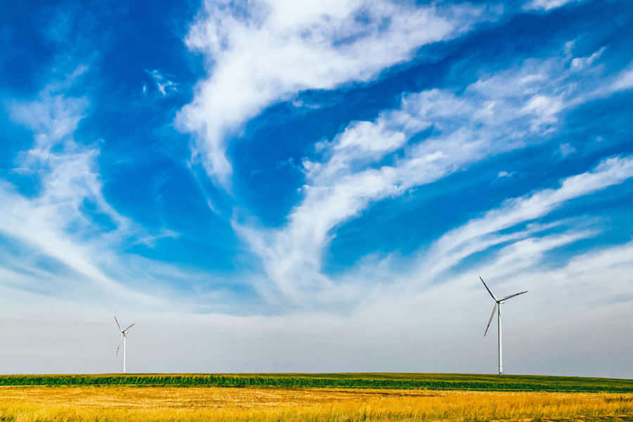 Wind Turbines And Solar Panels In A Green Field Wallpaper