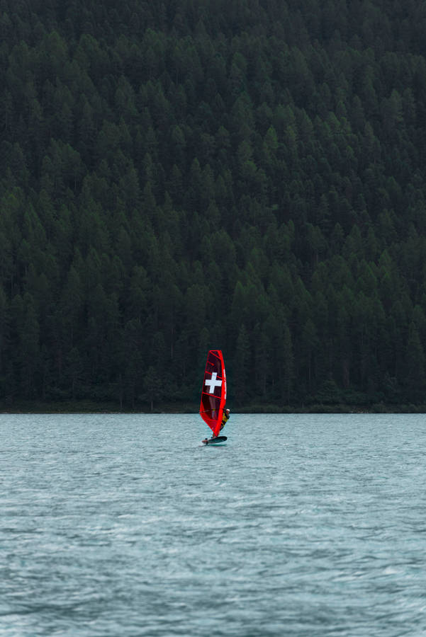 Windsurfing Sail With A Cross Wallpaper