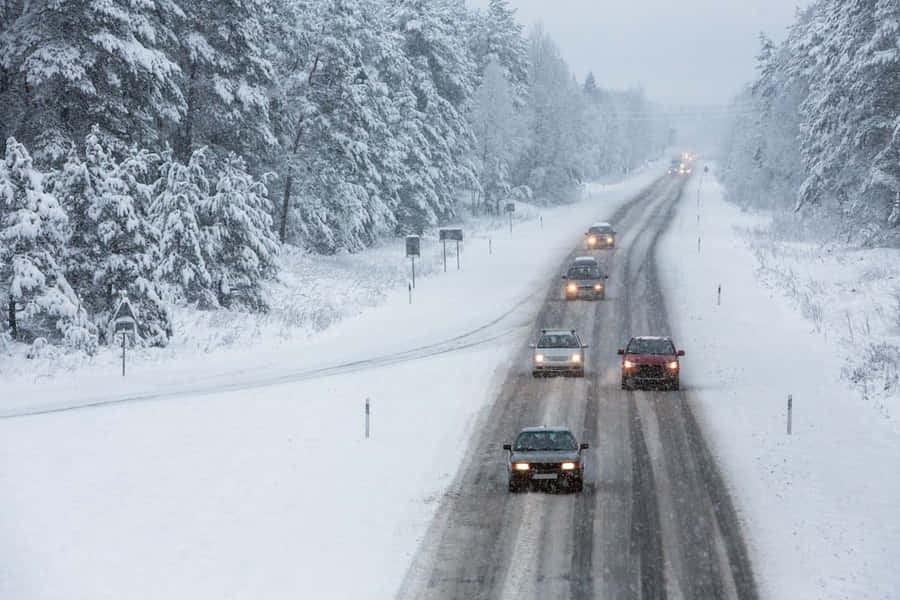 Winter Driving On Snowy Road Wallpaper