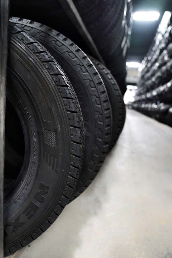 Winter Tires In Action On Snowy Road Wallpaper