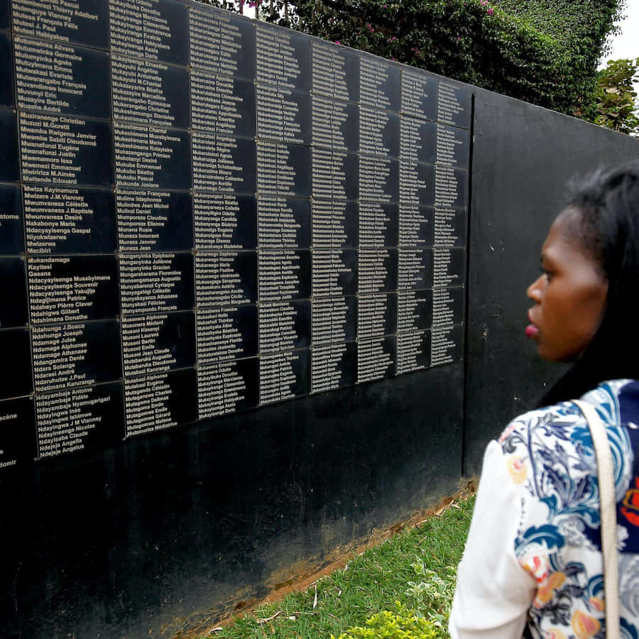 Woman At Kigali Genocide Memorial Black Wall Wallpaper