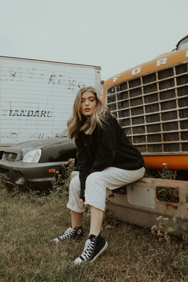 Woman Modeling Classic Converse Sneakers Wallpaper