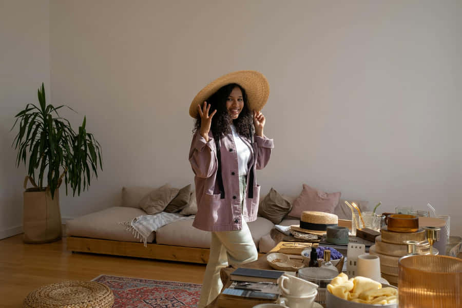 Woman With Straw Hat And Purple Jacket Wallpaper