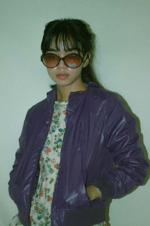 Womanin Purple Jacketand Sunglasses Wallpaper