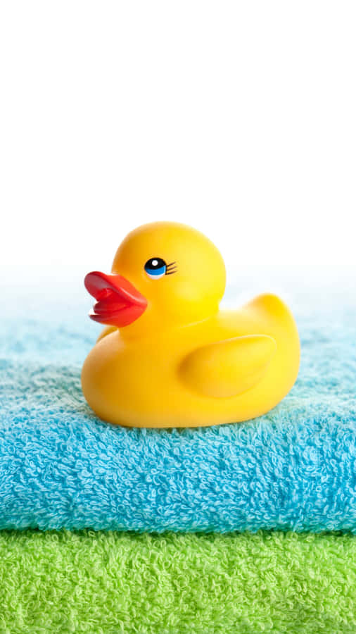 Yellow Rubber Duckon Towels Wallpaper