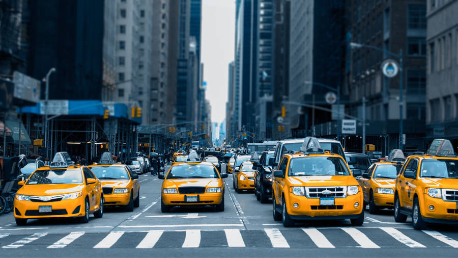 Yellow Taxi Beside Pedestrian Lane Wallpaper