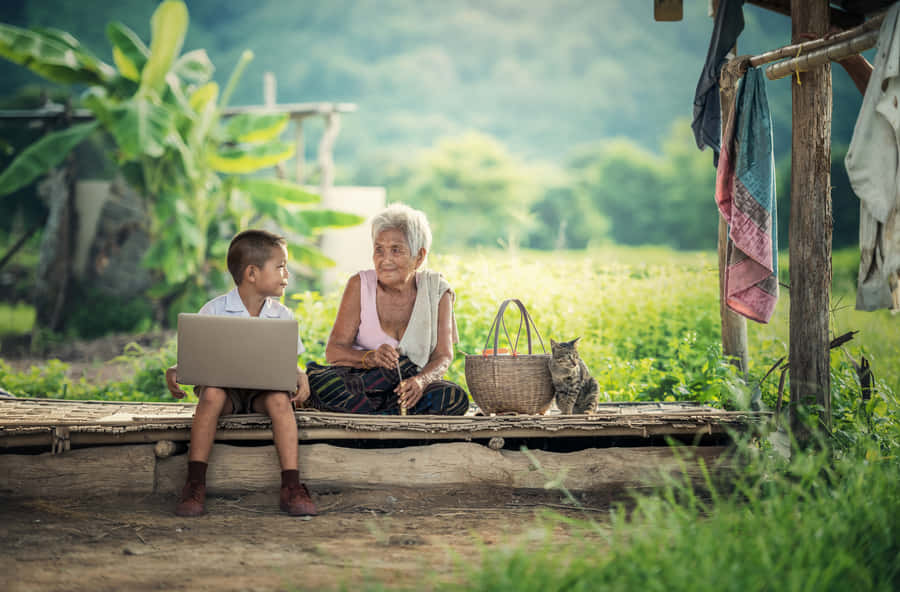 Young Boy Engaged In Online Learning On Teachable Wallpaper