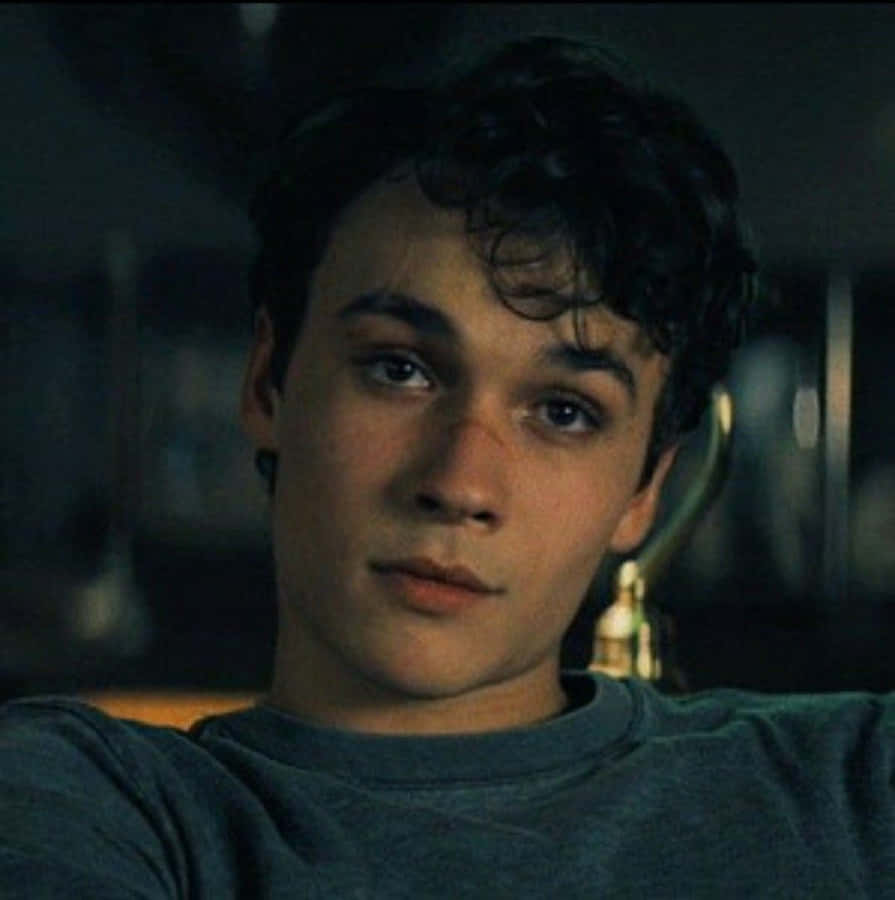 Young Man Contemplative Look Wallpaper