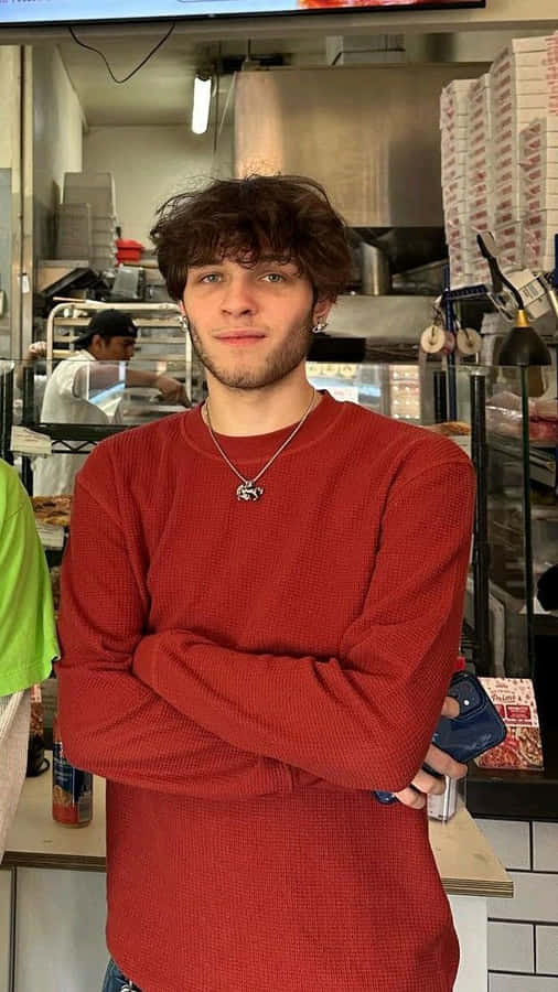 Young Manin Red Sweaterat Pizzeria Wallpaper