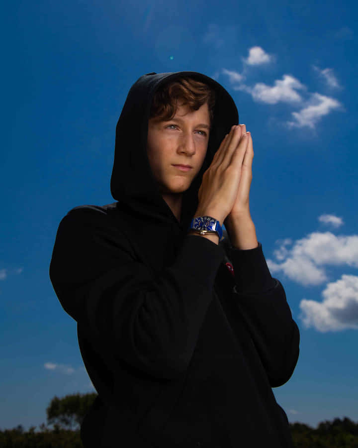 Youthful Contemplation Under Blue Sky.jpg Wallpaper