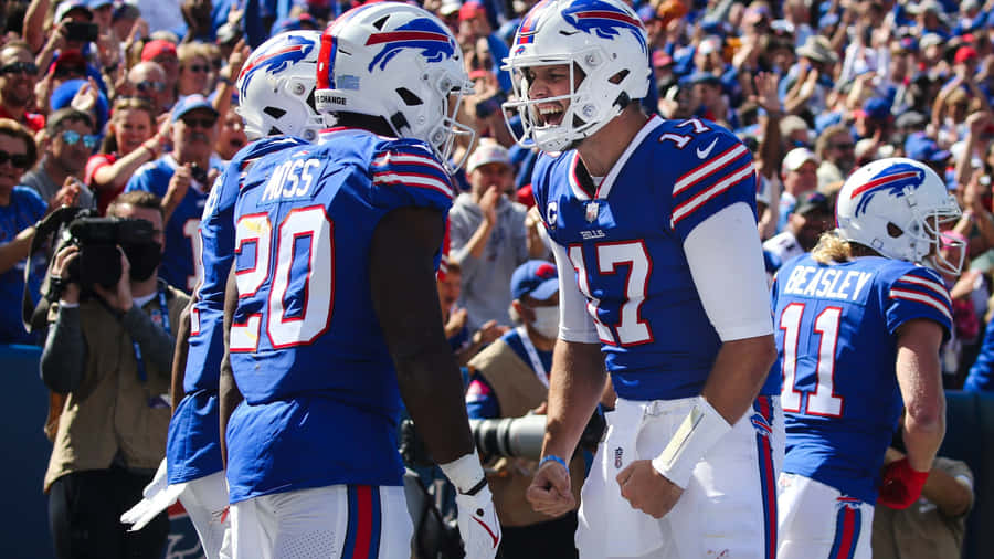 Zack Moss Celebrationwith Teammate Wallpaper