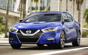 2022 Nissan Maxima Cruising On The Highway Wallpaper