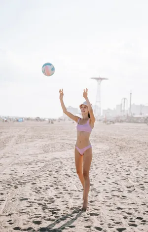 3 Talented Volleyball Players With A Passion For The Game Wallpaper