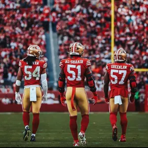 49ers Linebackers Walkingon Field Wallpaper
