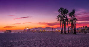 4k Beach With Amusement Park Wallpaper