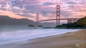 4k Beach With Metallic Bridge Wallpaper