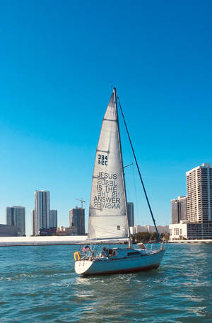 4k Beach With Sailing Boat Wallpaper