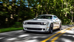 4k Dodge Hellcat Driving Through Shaded Road Wallpaper