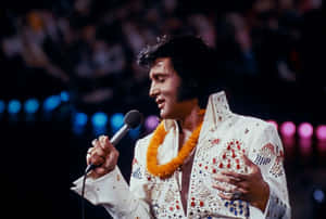 4k Elvis With An Orange Garland Wallpaper