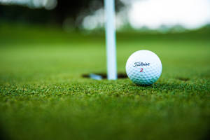 4k Golf Ball Near Hole Wallpaper