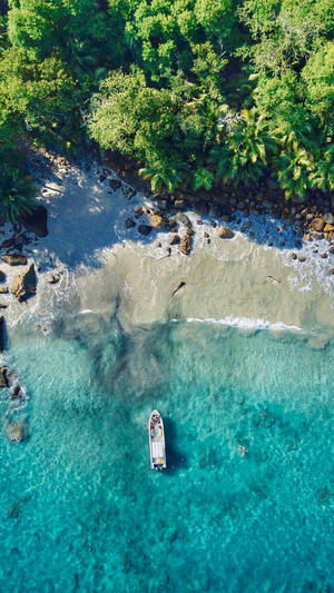 4k Iphone White Boat Coming To Island Beach Wallpaper