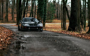 4k Jdm Toyota Supra On Wet Road In Autumn Wallpaper