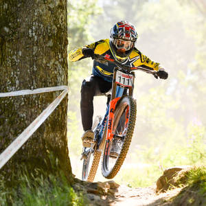 4k Mountain Bike Rider With Helmet Wallpaper