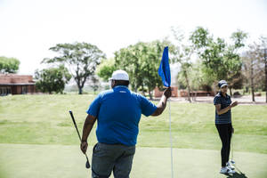 4k Person Holding Flaglet In Golf Wallpaper