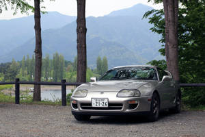 4k Toyota Supra In Nature Park Wallpaper