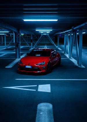 4k Toyota Supra Red In Parking Area Wallpaper