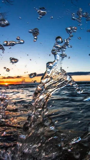 8k Iphone Water Splash In Beach Waves Wallpaper