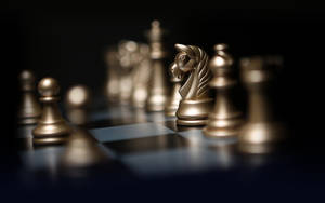 8k Ultra Hd Gold Chessboard Pieces Wallpaper