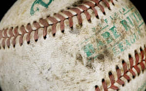 A Baseball Is On A Black Background Wallpaper