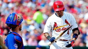 A Baseball Player Is Holding A Bat Wallpaper