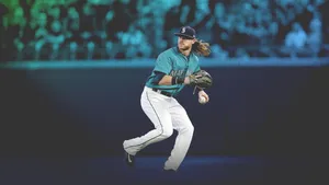 A Baseball Player Is Running With A Ball In His Hands Wallpaper
