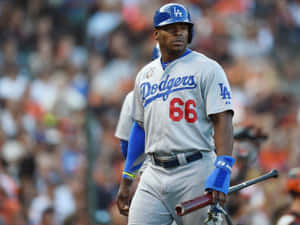 A Baseball Player Is Walking On A Field Wallpaper