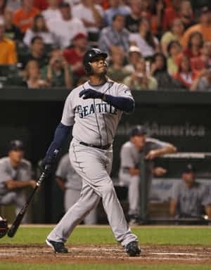 A Baseball Player Swinging A Bat Wallpaper